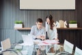 Business coworkers discussing in meeting room in office Royalty Free Stock Photo