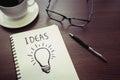 Business creativity concepts ideas.light bulb drawing on notepad Royalty Free Stock Photo