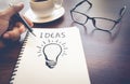 Business creativity concepts ideas.light bulb drawing on notepad Royalty Free Stock Photo