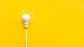 Business creativity and inspiration concepts with lightbulb and pencil on yellow background Royalty Free Stock Photo