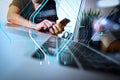 businessman hand working with new modern computer and smart phone and business strategy on wooden desk as concept Royalty Free Stock Photo