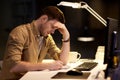Man with notepad working late at night office Royalty Free Stock Photo