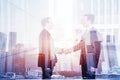 Business deal, handshake double exposure, cooperation concept Royalty Free Stock Photo
