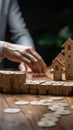 Business defense Hands safeguard dominoes, symbolizing risk control and insurance