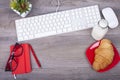 Business desk with a keyboard and breakfast Royalty Free Stock Photo