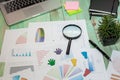 Looking at growth chart with magnifying glass. Graphs, charts an Royalty Free Stock Photo