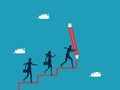 Business development leader. businessman draws a ladder with a big pencil and the work team walks up the ladder