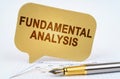 On the business diagram is a pen and a sign with the inscription - FUNDAMENTAL ANALYSIS Royalty Free Stock Photo