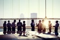 Business Discussing at Sunset Reflected onto Table