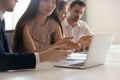 Business discussion, asian employee talking to colleague pointing at laptop Royalty Free Stock Photo