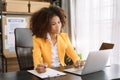 Business documents on office desk with laptop and tablet and graph business diagram and woman working at office Royalty Free Stock Photo