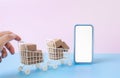 Business ecommerce or online shopping concepts with c2c and smartphone and product box order in trolley Royalty Free Stock Photo