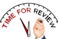 Hand writing TIME FOR REVIEW on drawn clock with marker on transparent wipe board Royalty Free Stock Photo