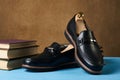 Business education concept with mens black leather shoes, close-up. Royalty Free Stock Photo