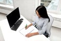 Businesswoman writing to notebook at office Royalty Free Stock Photo