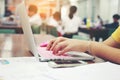 Business, education, people and technology concept - close up of female hands typing on keyboard of laptop computer with Blurred Royalty Free Stock Photo