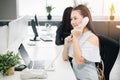 Business employee in phone calling to help support customer in office happy smile to service Royalty Free Stock Photo