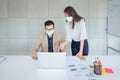 Business employees wearing mask during work in office to keep hygiene follow company policy.Preventive during the period of