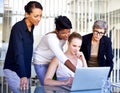 Business, employees and women with a laptop, brainstorming and teamwork at the workplace. Female consultants, agents and