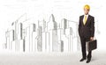 Business Engineer man with building city drawing in background Royalty Free Stock Photo