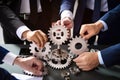 Business engineers people teamwork working together combining gears Generative AI Illustration