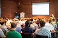 Speaker giving presentation on scientific business conference. Royalty Free Stock Photo