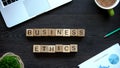 Business ethics phrase made of wooden cubes, behavior rules in company team Royalty Free Stock Photo