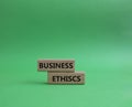 Business ethics symbol. Concept word Business ethics on wooden blocks. Beautiful green background. Business and Business ethics Royalty Free Stock Photo