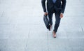 Business executive with briefcase going up the stairs. Royalty Free Stock Photo