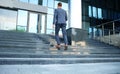 Business executive with briefcase going up the stairs. Royalty Free Stock Photo