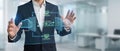 Business executive using high tech virtual touchscreen with icons for security, scheduling, and financial analysis. Royalty Free Stock Photo