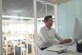 Business executive working on computer at desk in a modern office Royalty Free Stock Photo