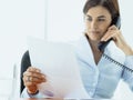 Business executive working in the office and making phone calls Royalty Free Stock Photo