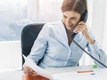 Business executive working in the office and making phone calls Royalty Free Stock Photo