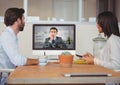 Business executives having video call with colleague on desktop computer Royalty Free Stock Photo