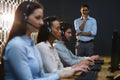 Business executives with headsets using computers at desk Royalty Free Stock Photo