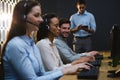 Business executives with headsets using computers at desk Royalty Free Stock Photo