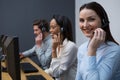 Business executives with headsets using computers at desk Royalty Free Stock Photo