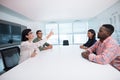 Business executives interacting in boardroom Royalty Free Stock Photo