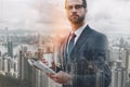 Business expert. Close-up portrait of handsome man holding popular newspaper and cup of coffee while waiting for Royalty Free Stock Photo