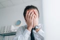 Business failure, businessman covering face with hands and crying in office Royalty Free Stock Photo