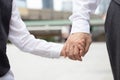 Business father holding his son`s hand and walking home after the evening`s work. Family businessman concept