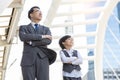 Business Father and son arms crossed and look at city with proud and confidence Child want to be like a his dad Parent and young Royalty Free Stock Photo