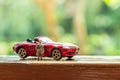 Business figure and toy car Royalty Free Stock Photo