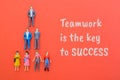 Business figures standing together with the text Teamwork is the Key to Success Royalty Free Stock Photo