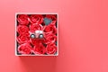 Miniature car model with love you on heart tag and red roses box on red background Royalty Free Stock Photo