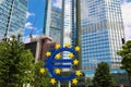 Business and finance concept with giant Euro sign at European Central Bank headquarters in the morning, business district in