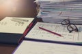 Business and finance concept of office working, Pile of unfinished documents on office desk, Closeup pencil with stack