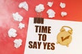 On a red background in smoke, crumpled paper and a sheet with the inscription - TIME TO SAY YES Royalty Free Stock Photo