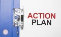 Business and finance concept. On the table are a notebook, a pen, documents and a folder with the inscription ACTION PLAN Royalty Free Stock Photo